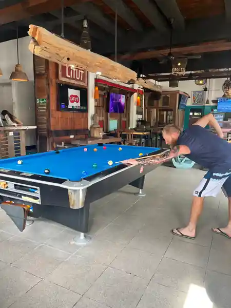 Pool table and bar area with LITUT signage at Litut Bar & Restaurant in Bali — salsa, bachata, kizomba venue in Bali