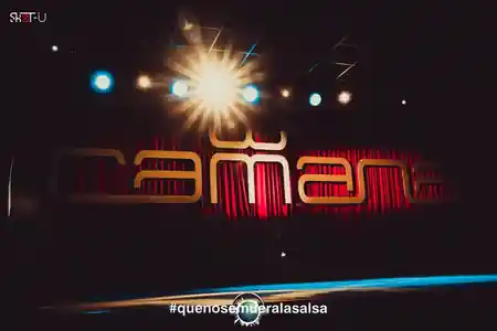Illuminated Camana stage sign with red curtain backdrop at Camana Club Milan — salsa, bachata, merengue, reggaeton, mix venue in Milan