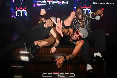 Performers posing on the Camana Club stage at a Latin dance night in Milan — salsa, bachata, merengue, reggaeton, mix venue in Milan