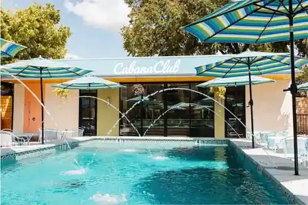 Cabana Club Austin pool area with Cabana Club sign — salsa, bachata venue in Austin