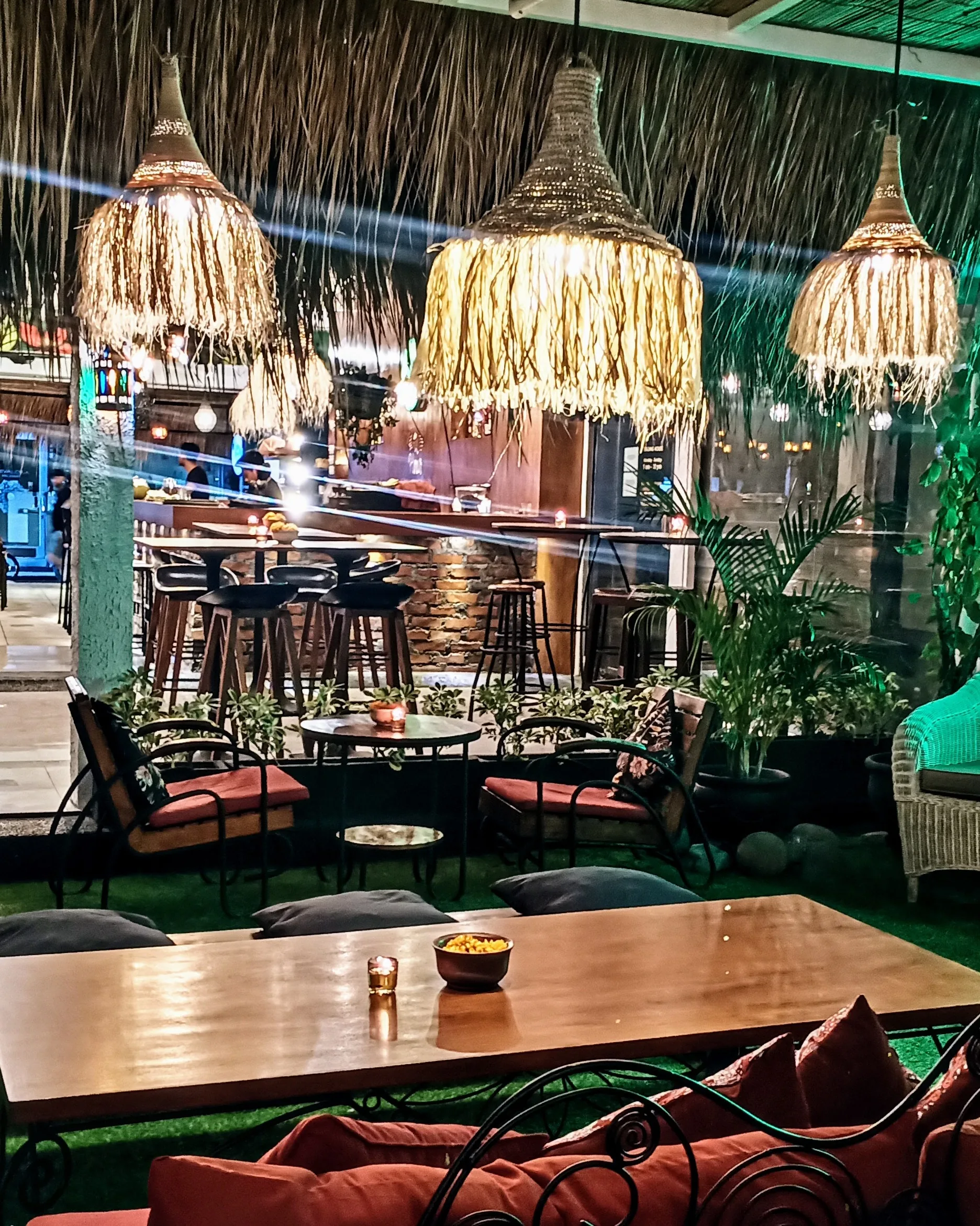 Atmospheric bar and lounge interior at Cafe Dunia in Bali at night