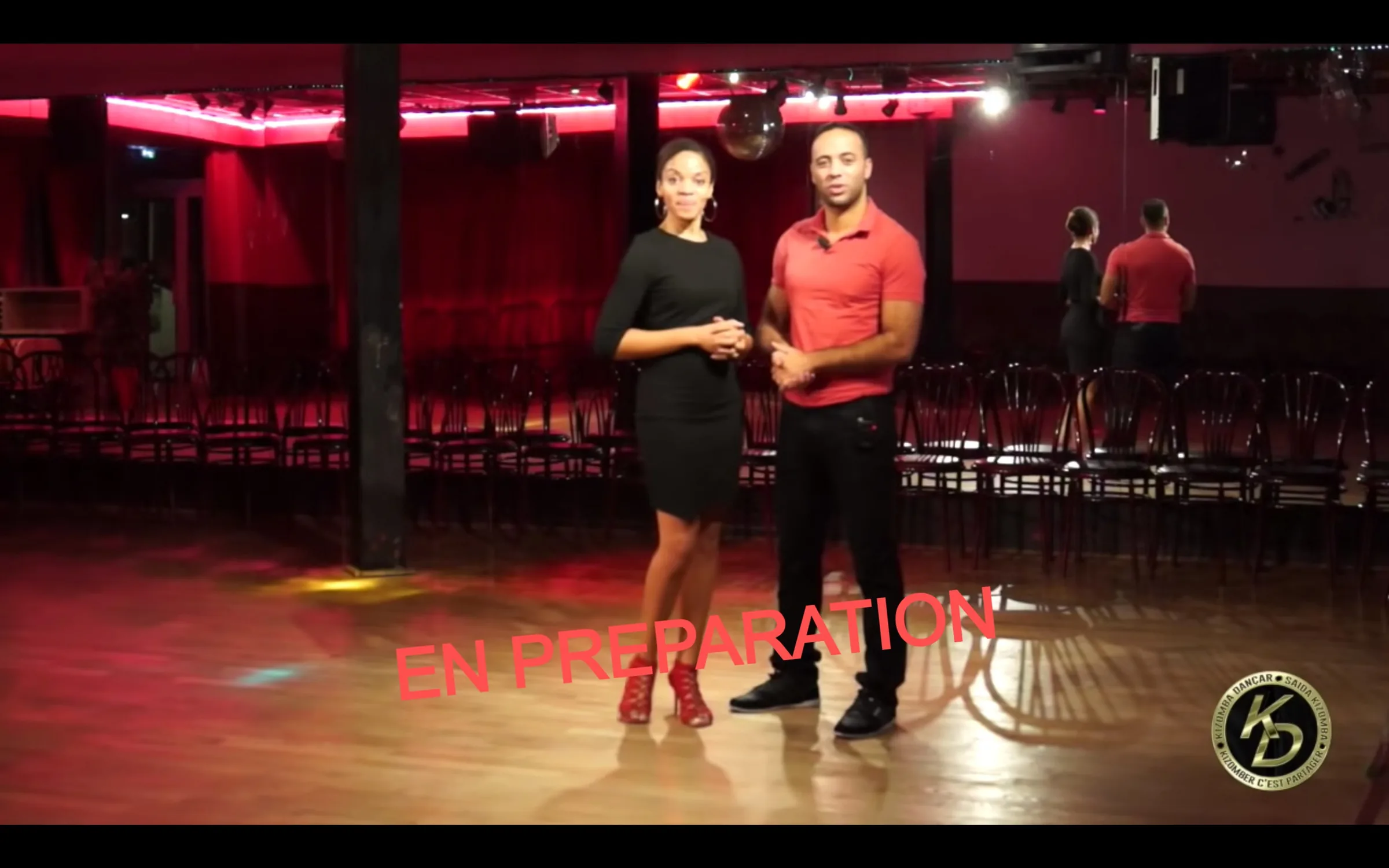 Red-lit dance floor and stage at DITC Saida Kizomba venue in Paris