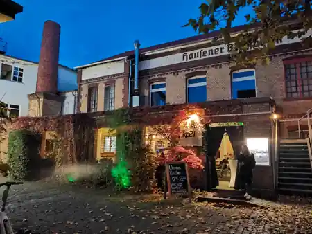 Brotfabrik Frankfurt evening exterior with illuminated facade — salsa, bachata, kizomba venue in Frankfurt