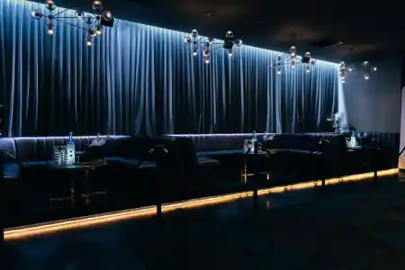 The Albion lounge seating with chandeliers and blue curtains at 172 York St South Melbourne — salsa venue in Melbourne