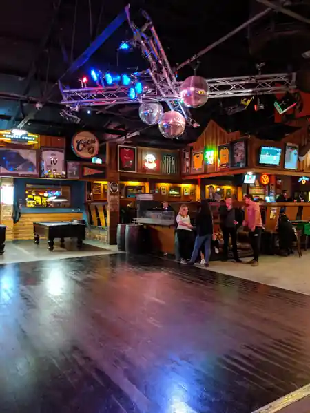 Mustang Bar Perth interior with dance floor, disco ball and bar in background — bachata, kizomba, salsa venue in Perth