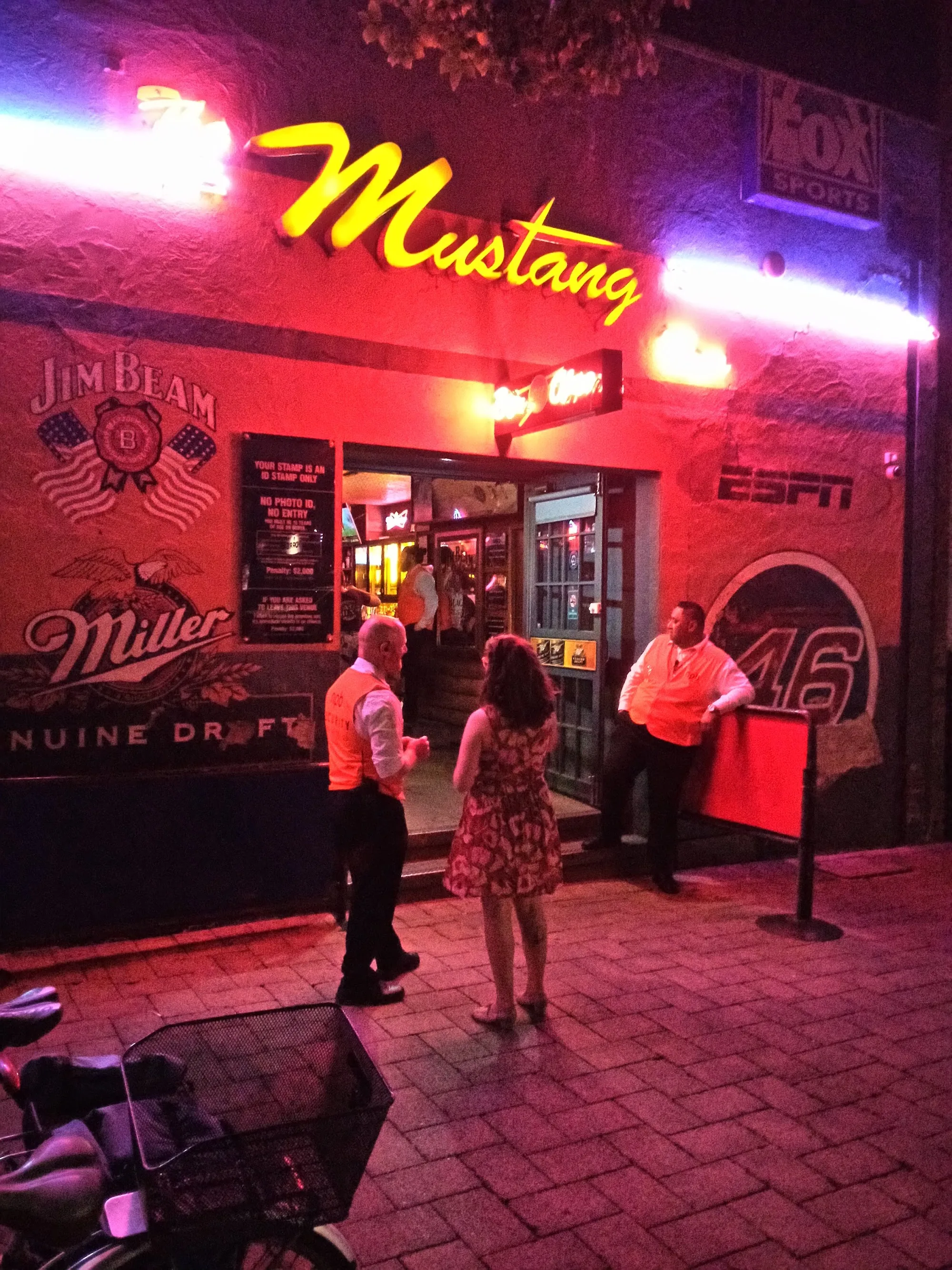 Mustang Bar Perth neon-lit exterior entrance at night with people outside