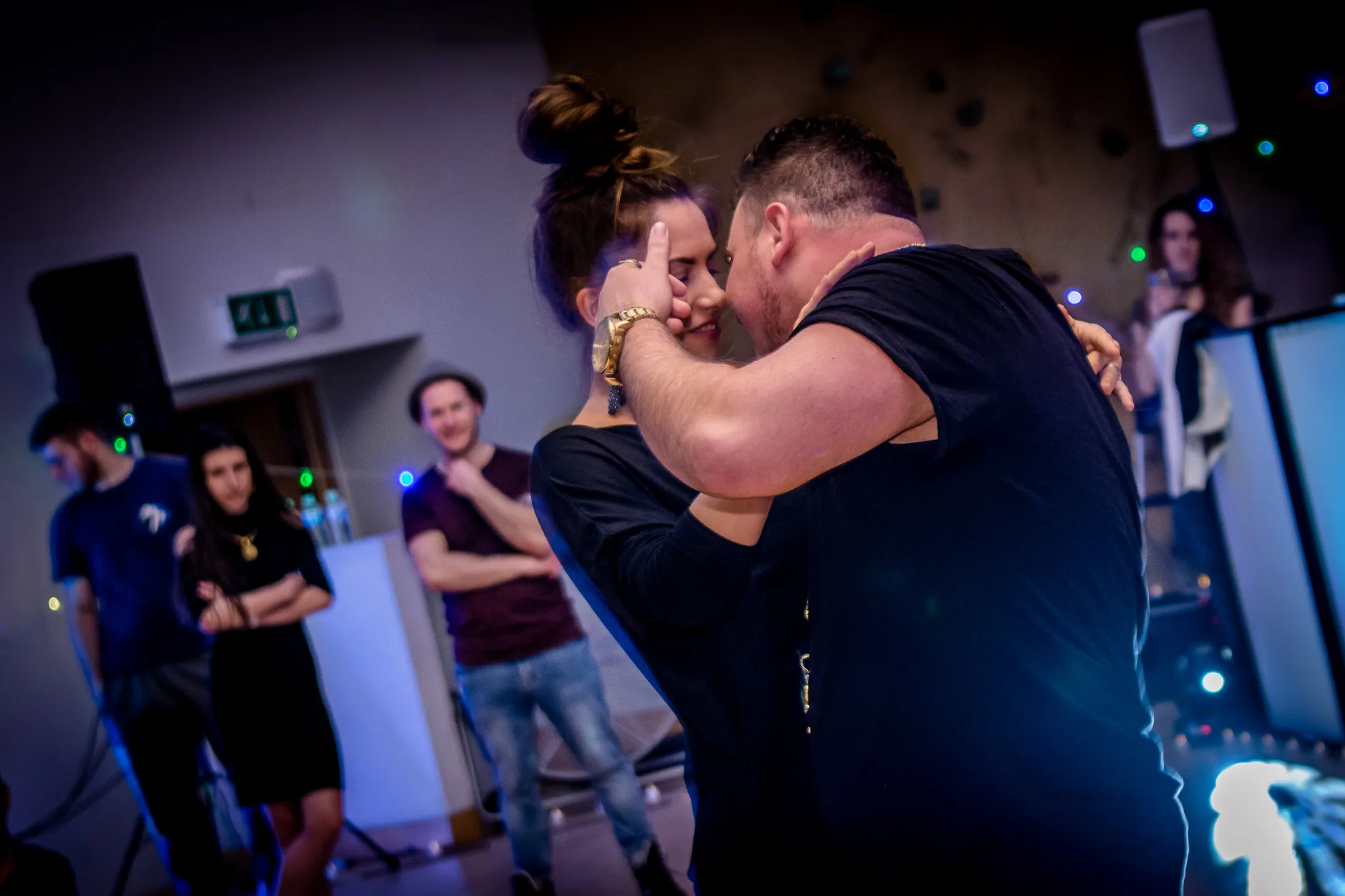 Zouk couple performing a dramatic dip under colorful party lights at Ballie Ballerson London