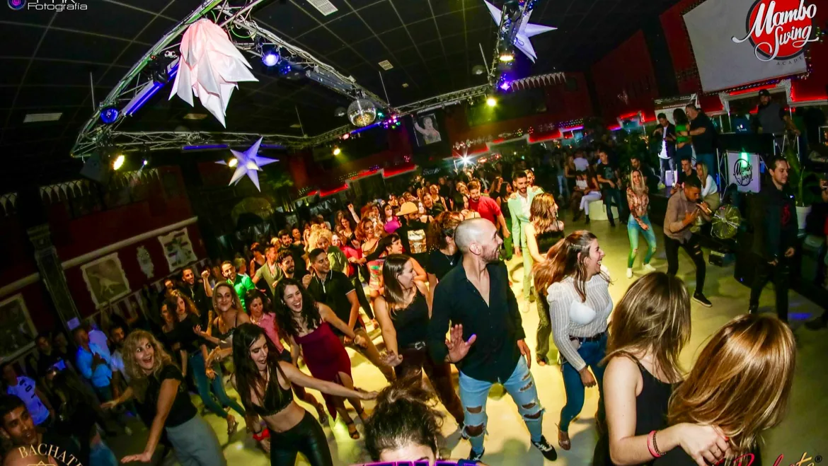 Packed dance floor with salsa dancers at Mambo Swing club in Madrid Spain