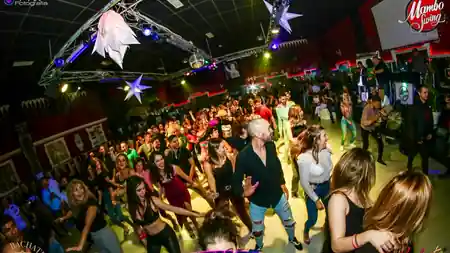 Packed dance floor with salsa dancers at Mambo Swing club in Madrid Spain