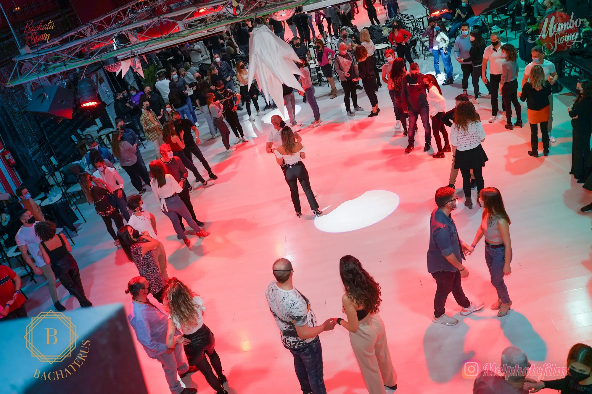 Overhead view of dancers on the Mambo Swing dance floor in Madrid with red lighting