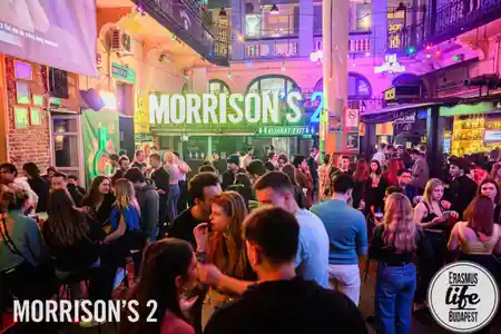 Crowd mingling in the courtyard bar at Morrison's 2 Klub in central Budapest — bachata venue in Budapest