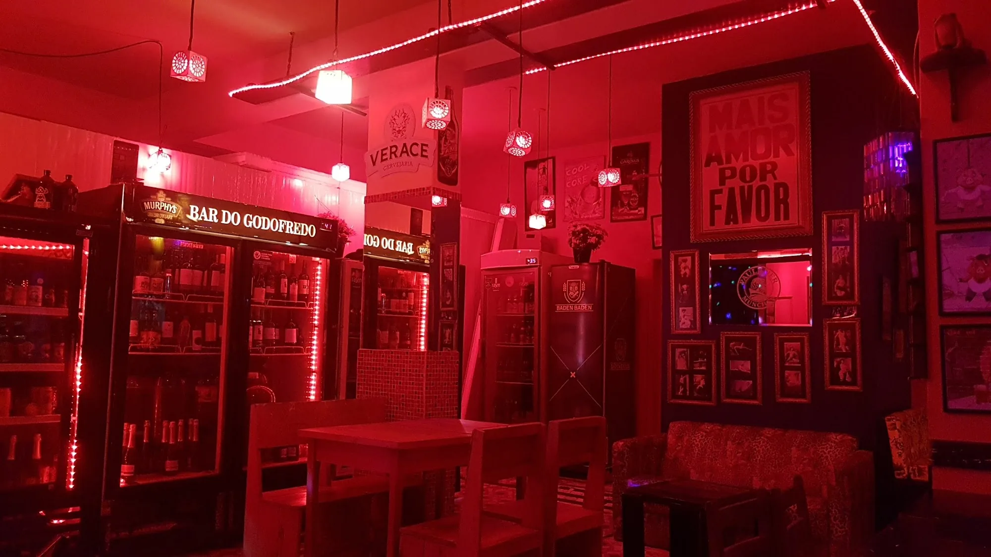 Bar interior with red LED lighting and Bar do Godofredo branding in Brasília