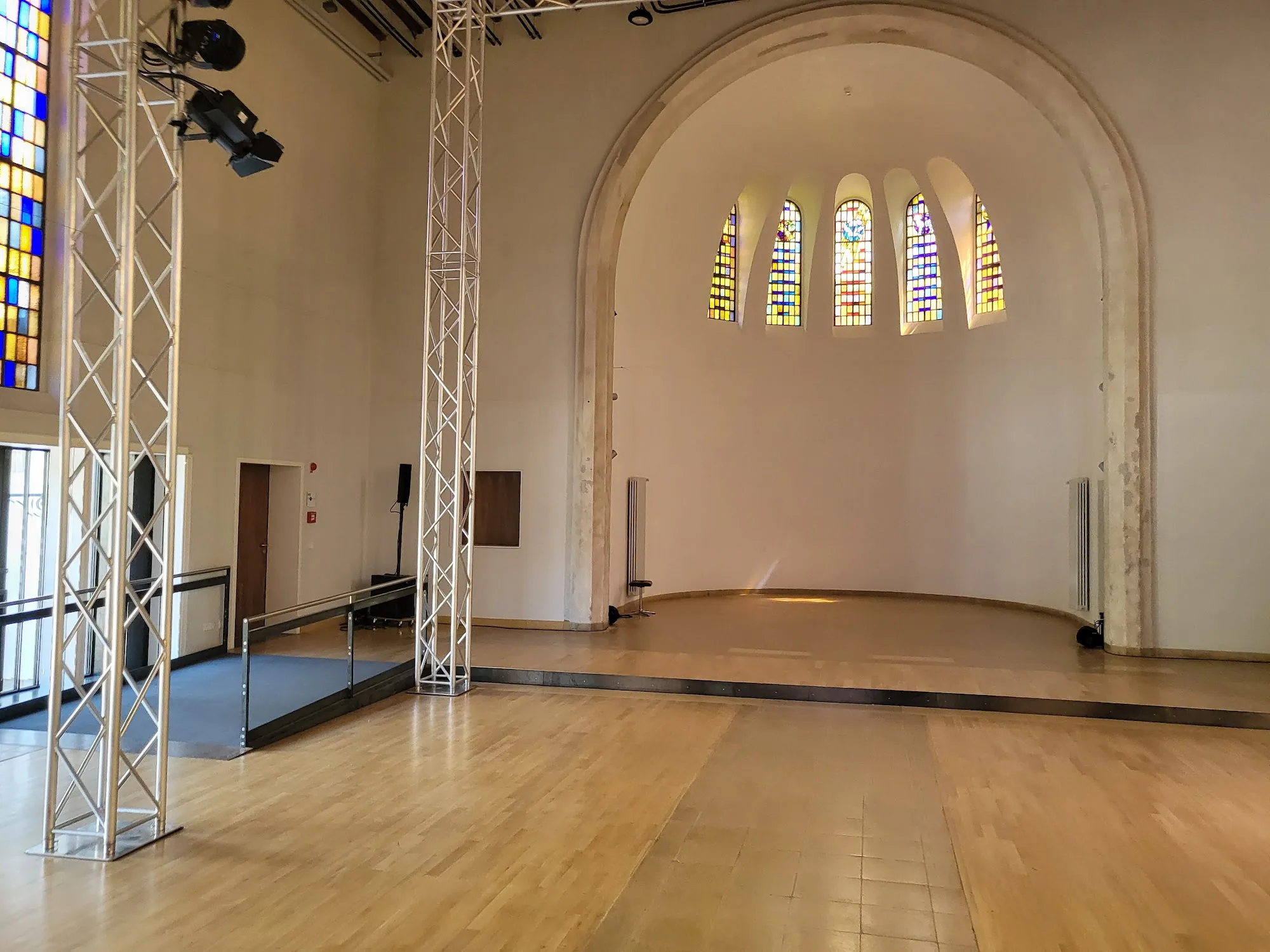 Beautiful chapel-converted dance hall with wooden floor and stained glass Heidelberg