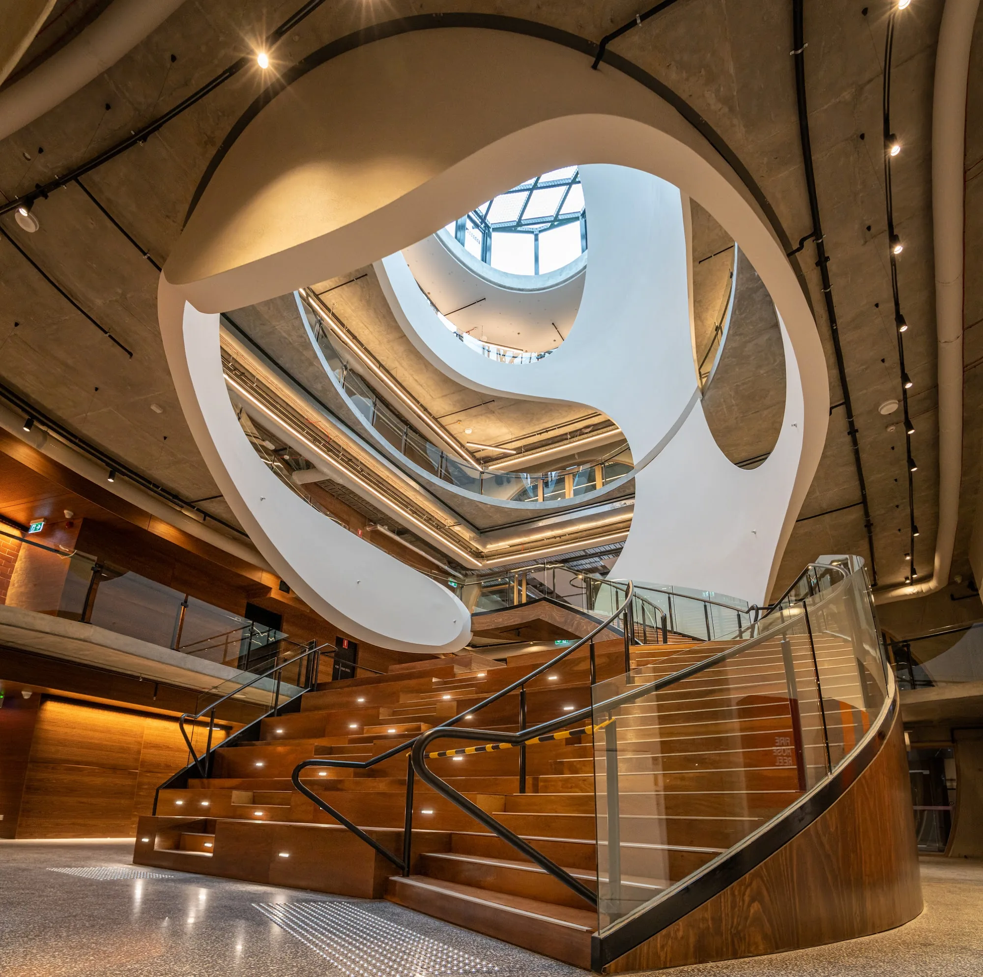 Dramatic spiral staircase atrium inside Victorian Pride Centre Melbourne — bachata, salsa, zouk venue in Melbourne