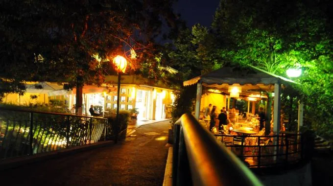 Bridge and pathway leading to Chalet dei Giardini Margherita in Bologna
