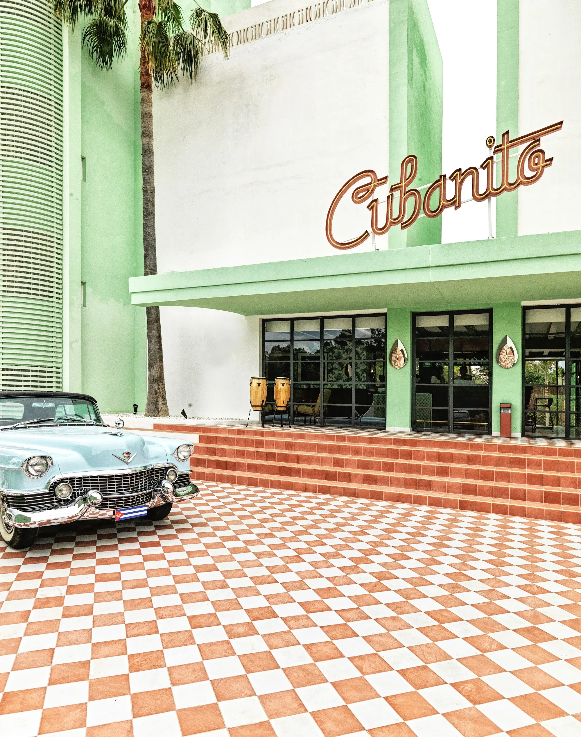 Malecón de Cubanito branded exterior with classic Cuban car outside in Munich Germany