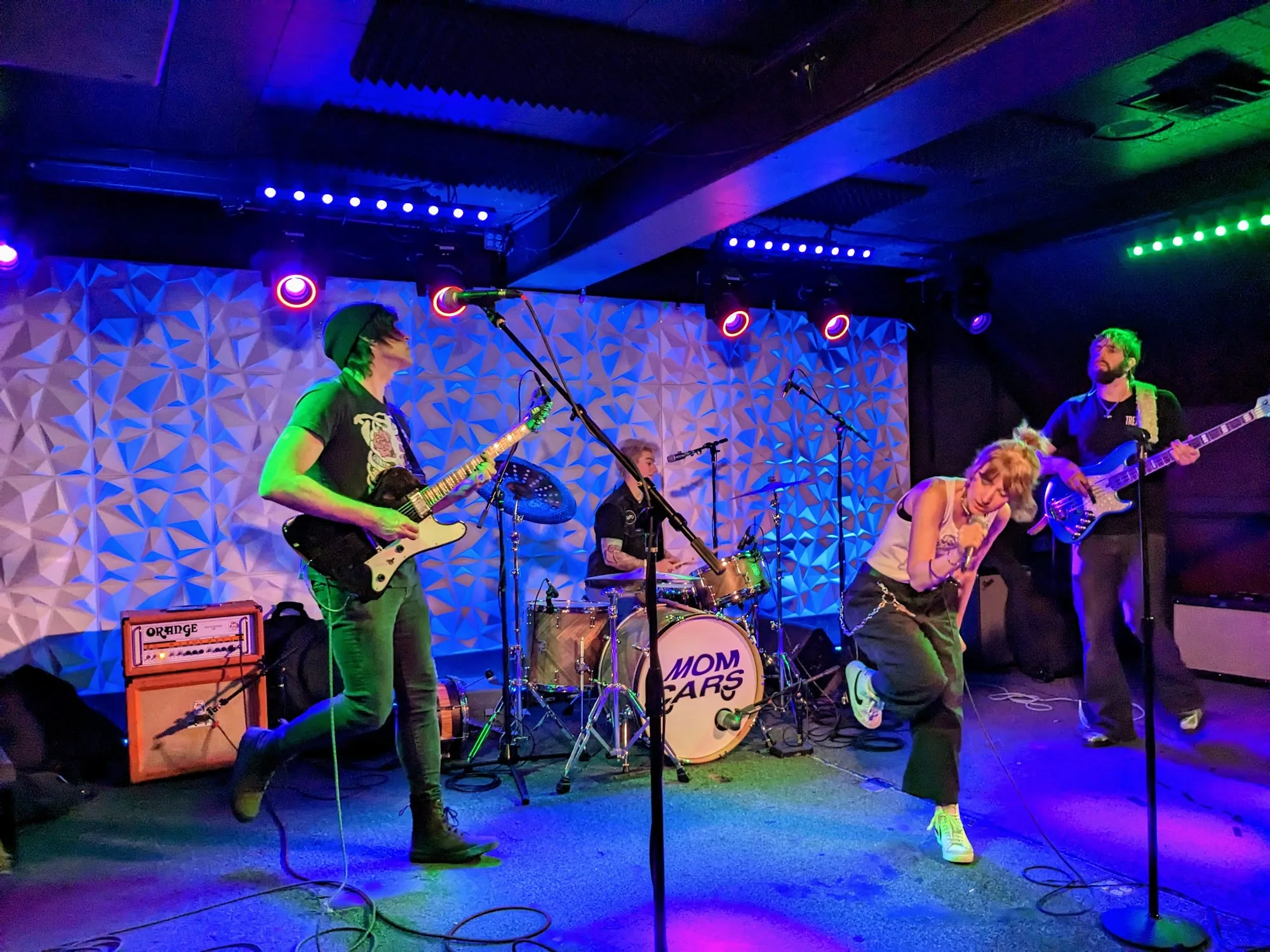 Live band performing under colorful stage lights at Neck of the Woods San Francisco — salsa, bachata venue in San Francisco