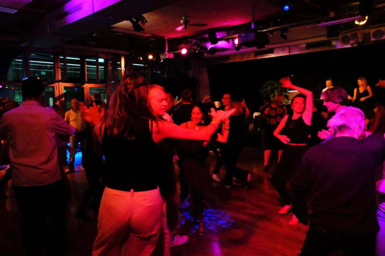 Couples dancing salsa at SalsaRica Latin party Zurich