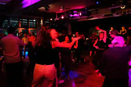 Couples dancing salsa at SalsaRica Latin party Zurich