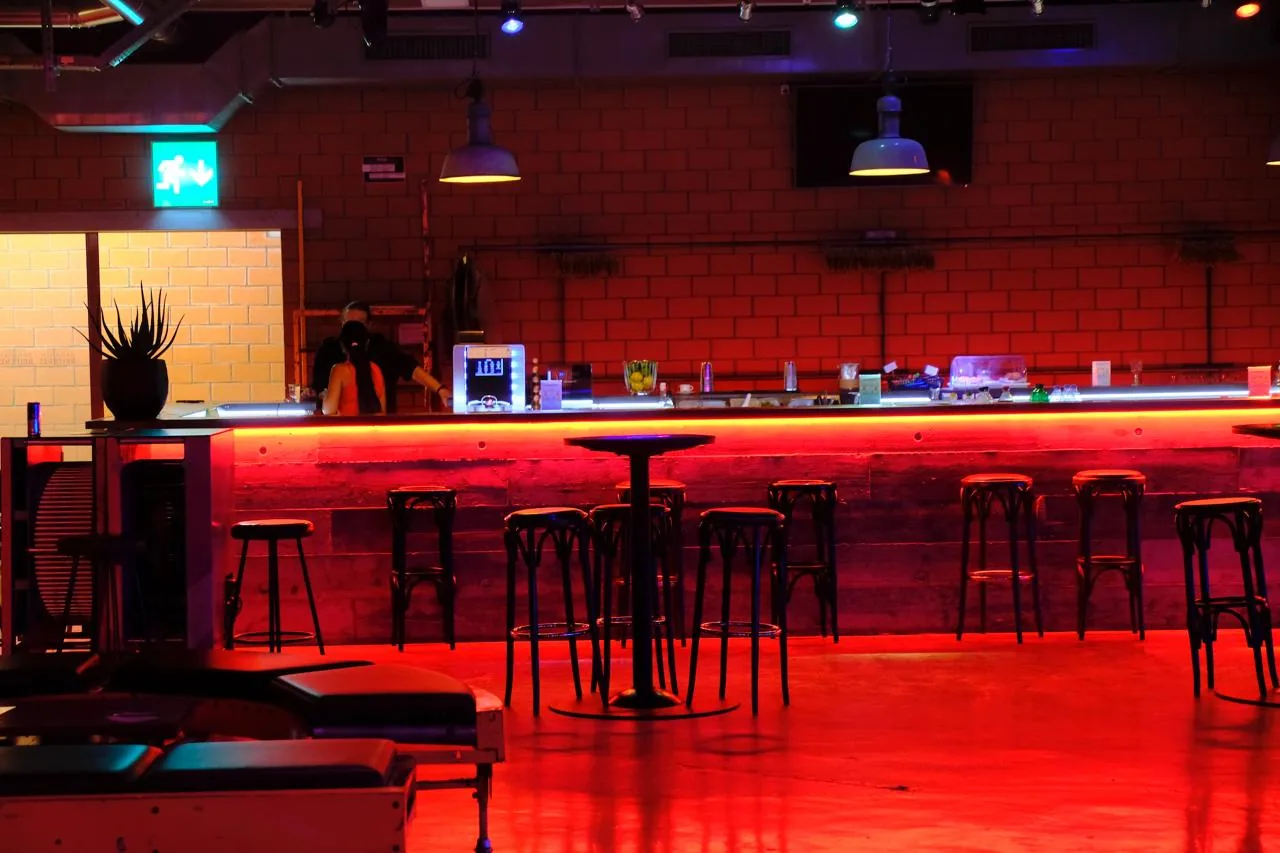 Bar area at Bananenreiferei with ambient red lighting