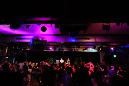 DJ spinning vinyl at SalsaRica party in Zurich