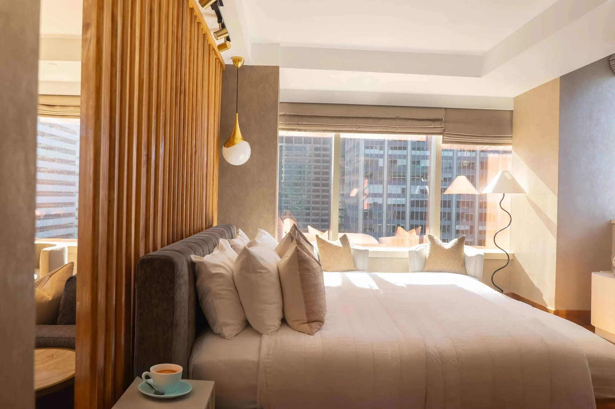 Ambassador suite bedroom with city view at Concorde Hotel New York