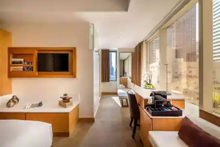 Deluxe guest room with Manhattan skyline view at Concorde Hotel New York, bachata venue in New York