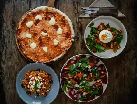 Rolling Fork Bali interior dining area in traditional Balinese joglo with ambient lighting — salsa, bachata venue in Bali
