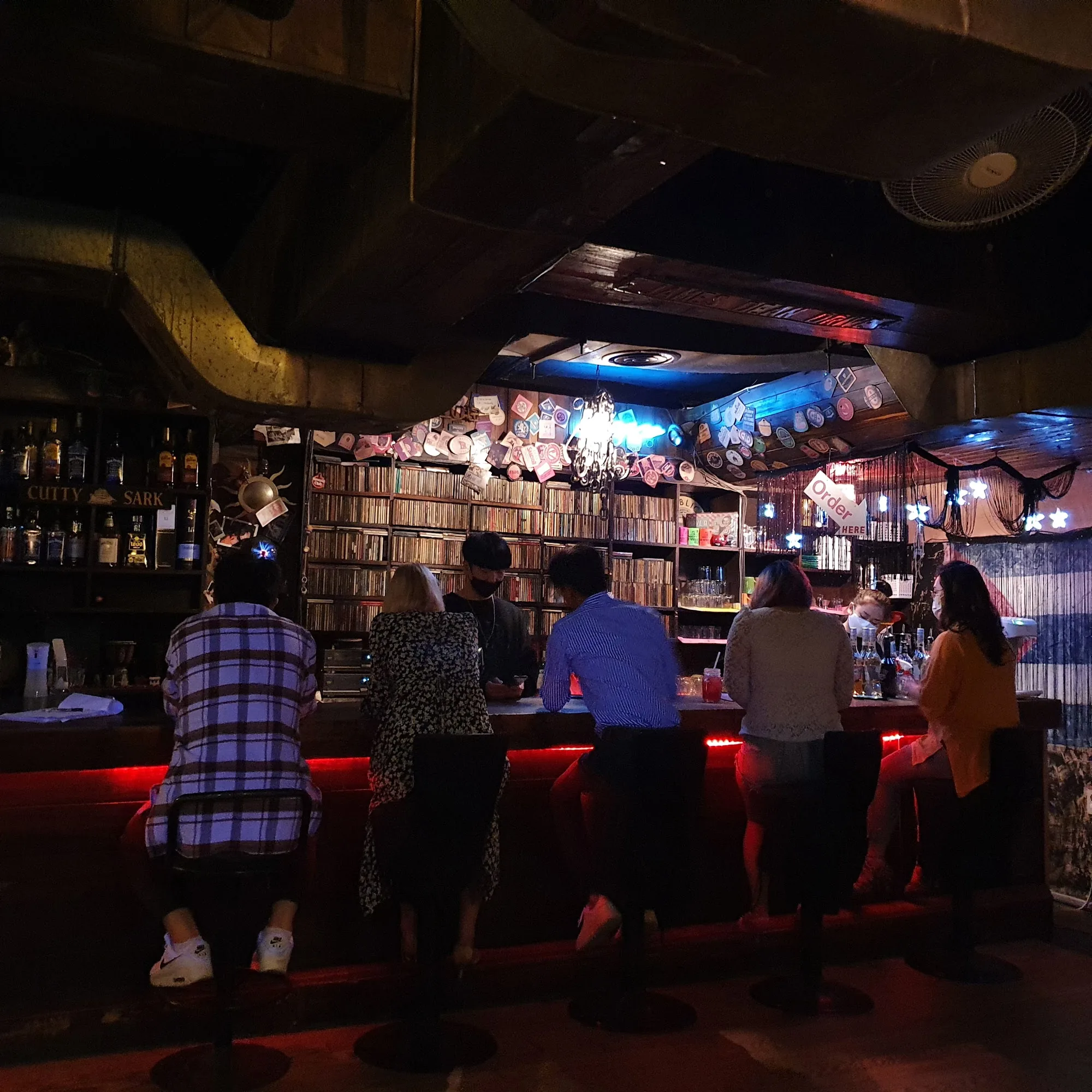 Bar interior with guests at counter at Club Havana Seoul salsa bar