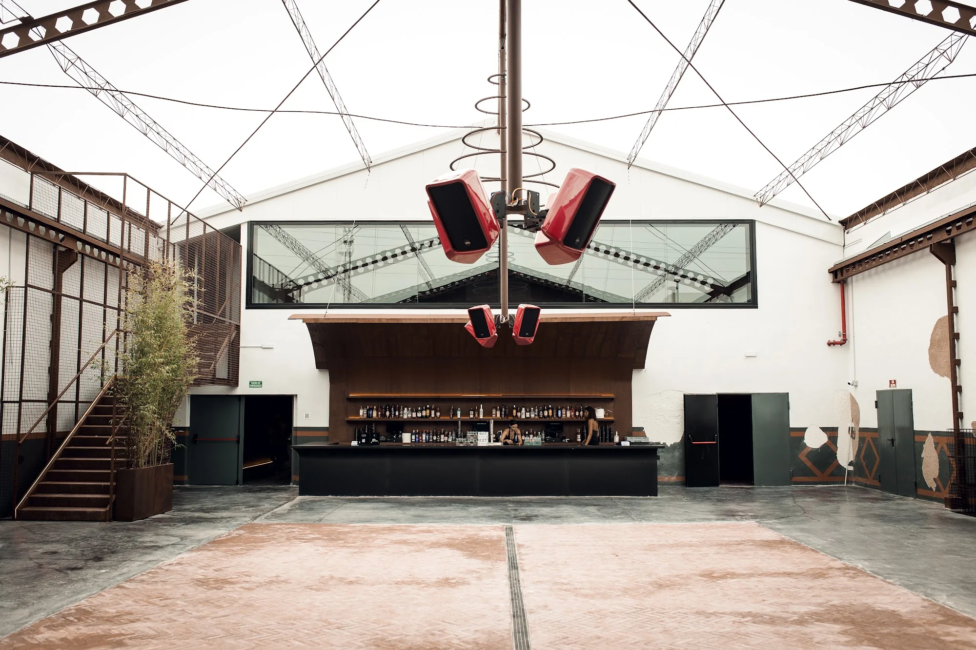 Empty dance floor and bar of Sala Pandora Seville in industrial warehouse venue space
