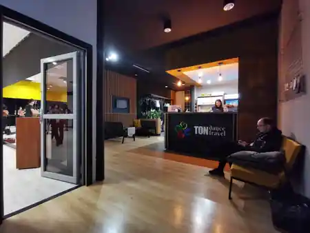 TONdance CAFE reception area and lobby with dance studio visible through glass wall in Lodz — bachata, salsa, kizomba, zouk venue in Lodz