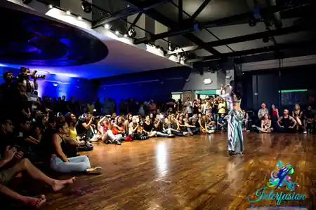Dance event with packed crowd and performer on wooden floor at Dance Loft on 14, Washington D.C. — zouk venue in Washington, D.C.