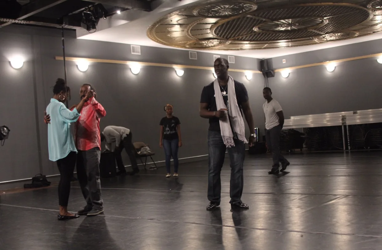 Social dancers practicing partner work under the ornate gold ceiling at Dance Loft on 14, Washington D.C.