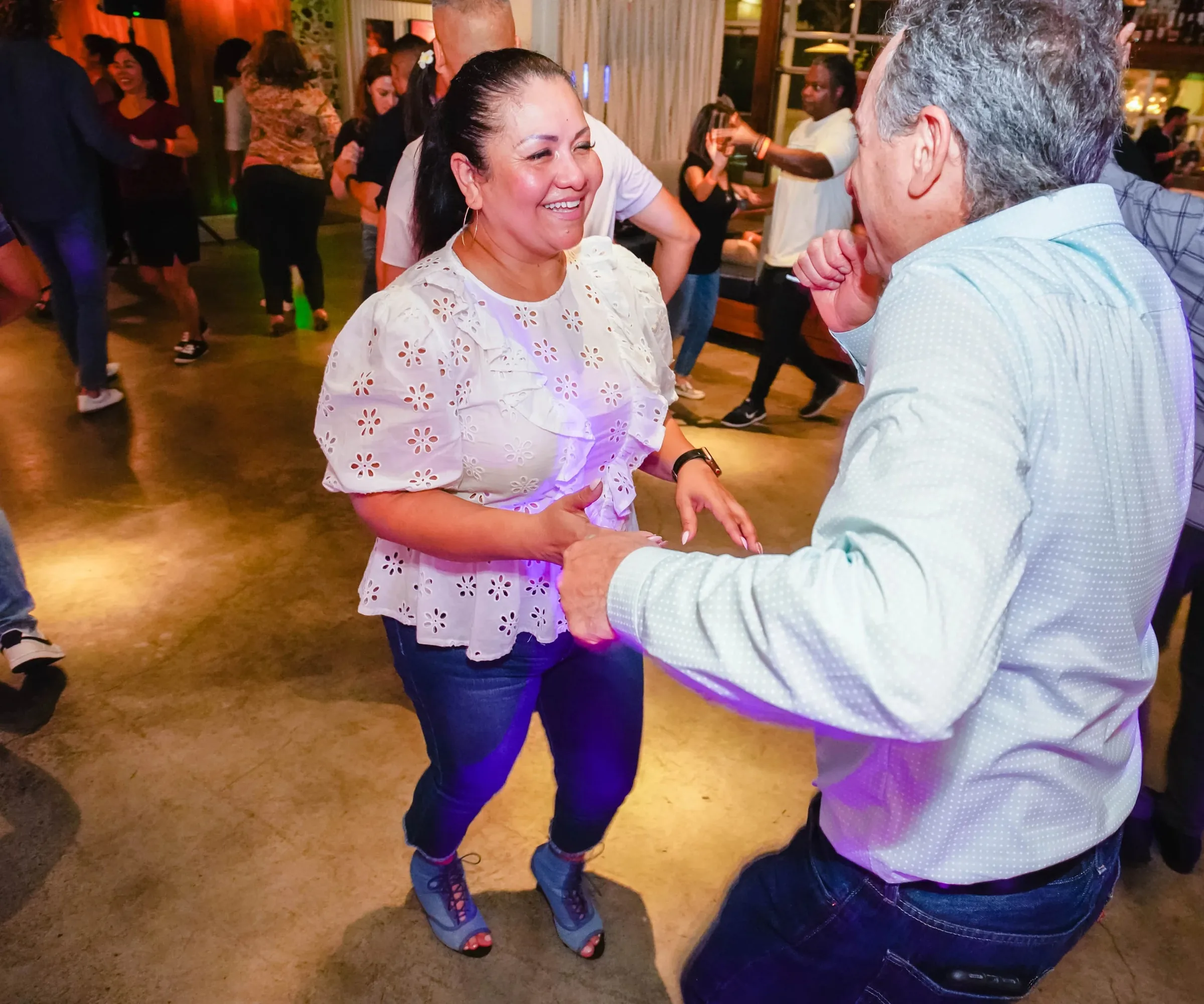Couple social dancing during a salsa and bachata party at Mariscos El Pacifico, Vista